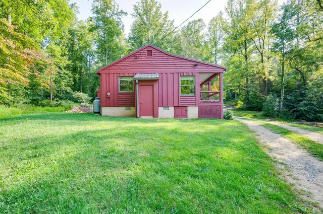 a view of a balcony with chair and floor to ceiling window