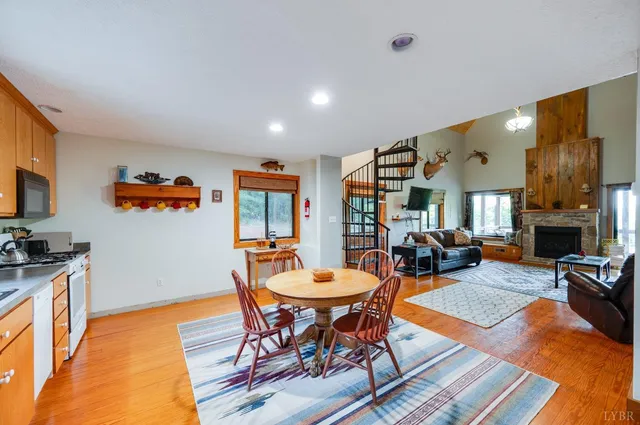 a view of a house with a yard and sitting area
