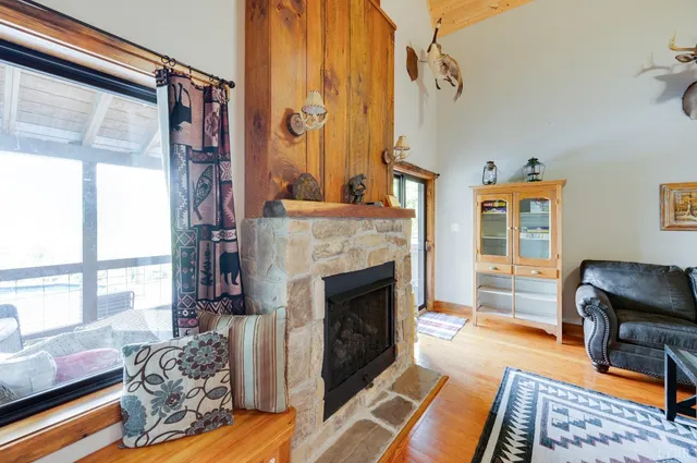 a kitchen with granite countertop a stove and a wooden floor
