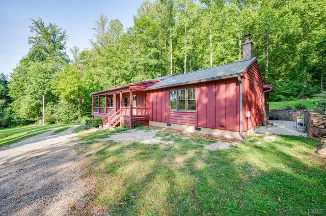 a kitchen with stainless steel appliances a stove a sink and cabinets