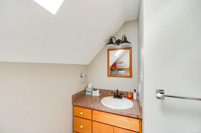 a view of a house with backyard and garden