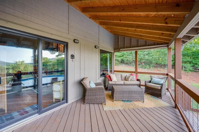 an aerial view of a house with yard swimming pool and outdoor seating