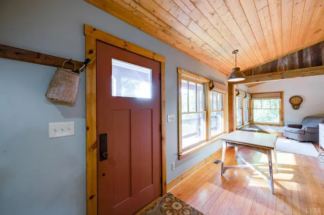 a bathroom with a granite countertop sink a mirror and shower
