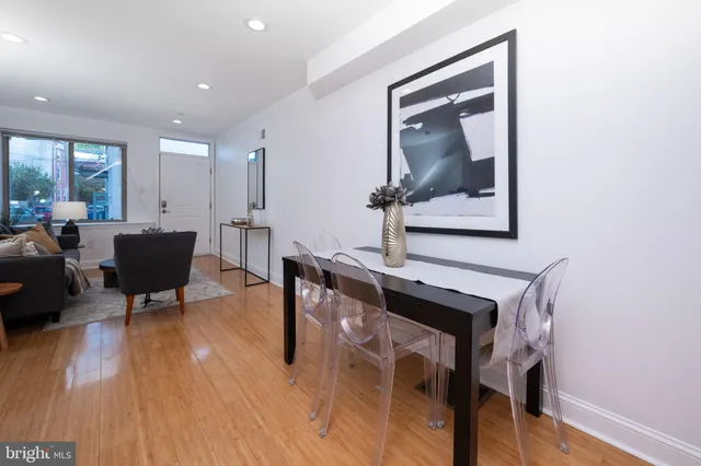 a view of an entryway with wooden floor