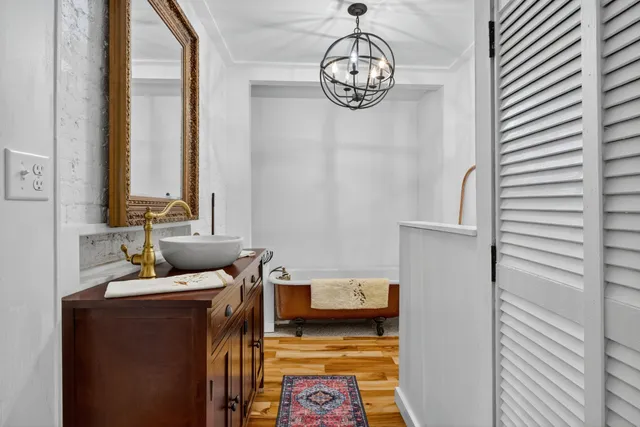a bathroom with a bathtub and shower