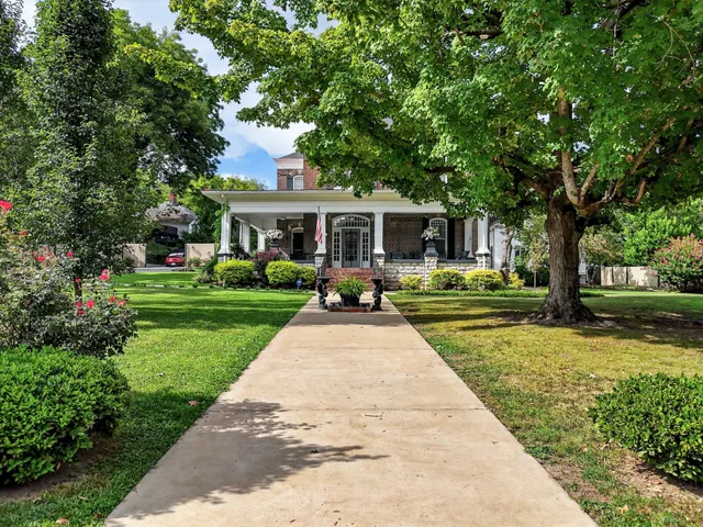 an aerial view of a house with a garden