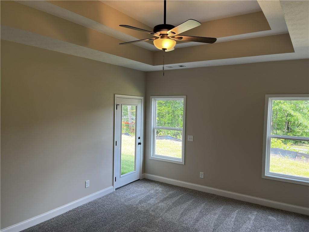 1932 Cochran Ridge Road Hiram, GA 30141 - Photo 21 of 30 an empty room with windows and fan