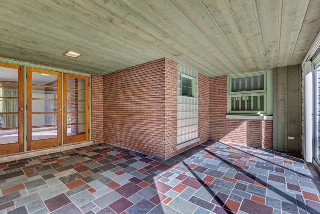 a view of a door and a window