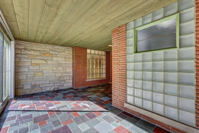 a view of an empty room with windows