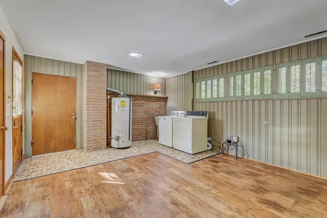 a view of a storage & utility room with a window