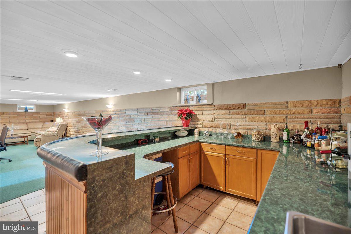 68 Riverside Avenue Roebling, NJ 08554 - Photo 16 of 33 a kitchen with stainless steel appliances granite countertop a sink counter space and a stove