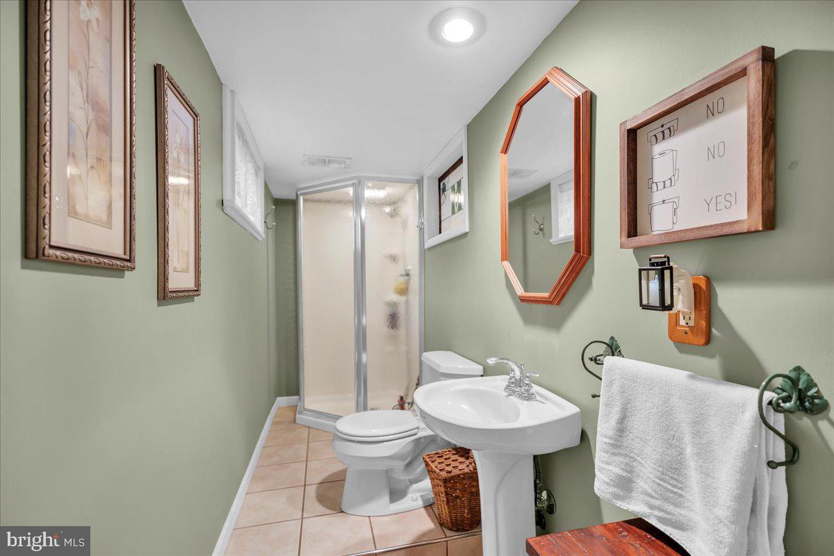 68 Riverside Avenue Roebling, NJ 08554 - Photo 17 of 33 a bathroom with a toilet sink and mirror