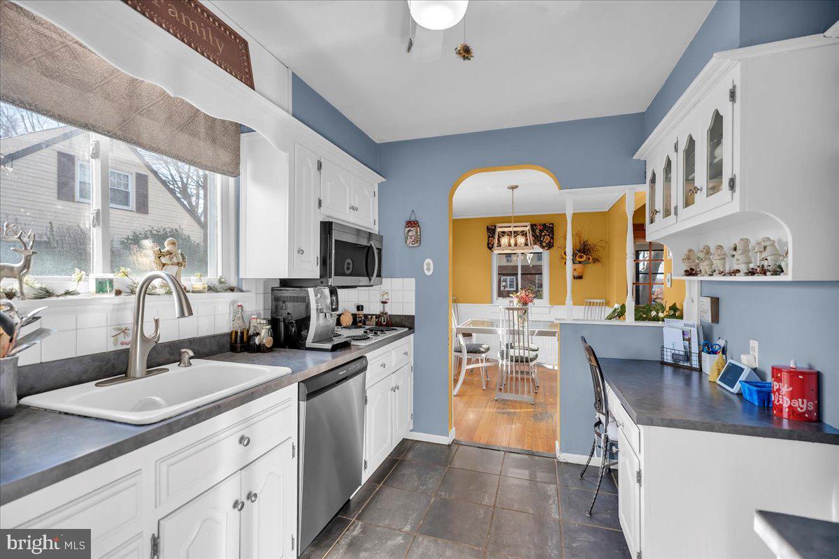 68 Riverside Avenue Roebling, NJ 08554 - Photo 6 of 33 a kitchen with stainless steel appliances a sink stove and cabinets