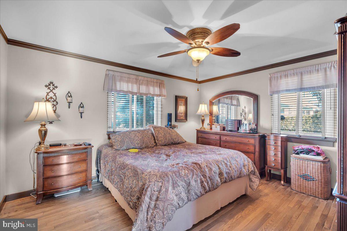 68 Riverside Avenue Roebling, NJ 08554 - Photo 7 of 33 a bedroom with a large bed and a chandelier