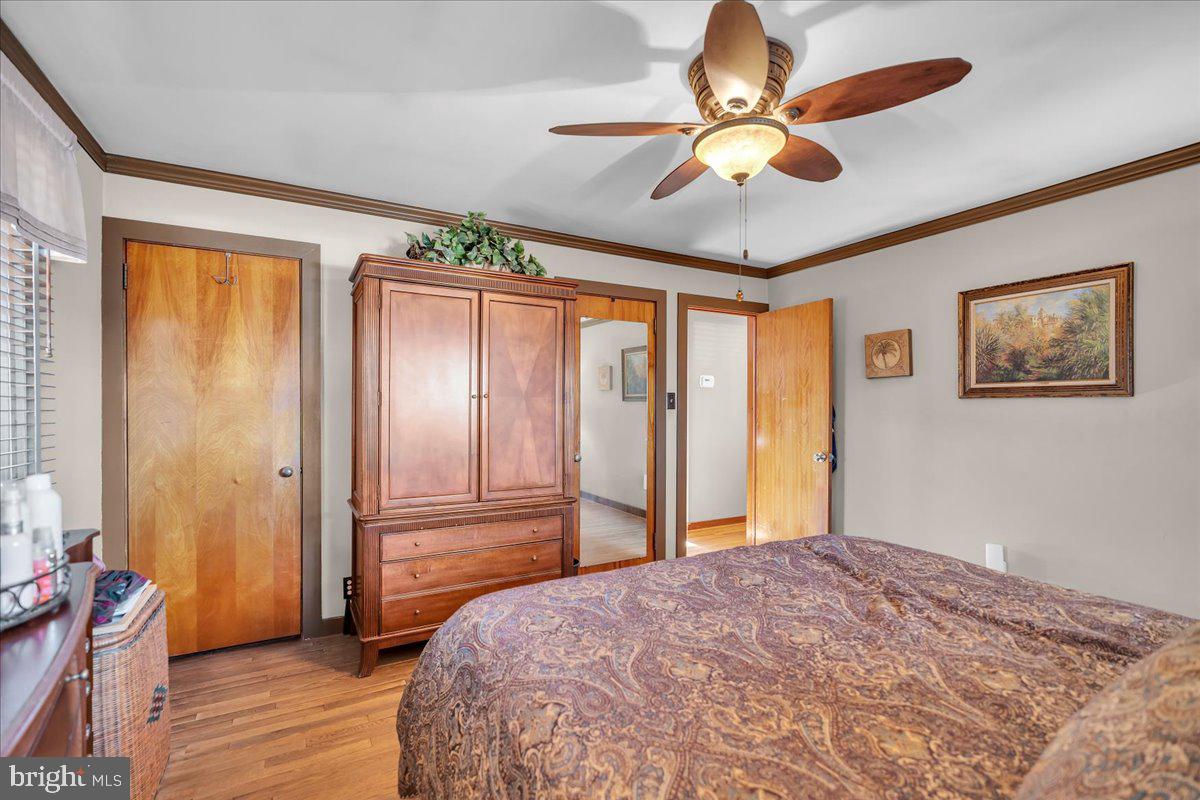 68 Riverside Avenue Roebling, NJ 08554 - Photo 8 of 33 a bedroom with a bed and a chandelier