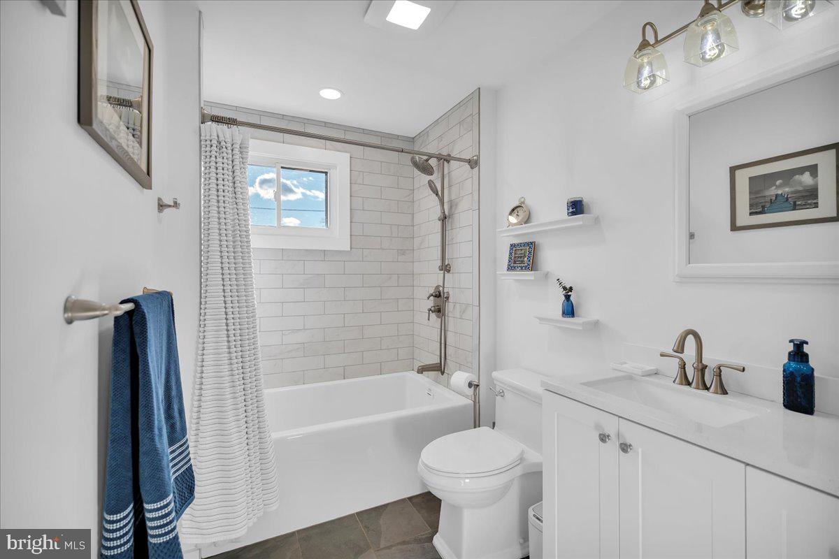 68 Riverside Avenue Roebling, NJ 08554 - Photo 9 of 33 a bathroom with a sink a toilet and shower