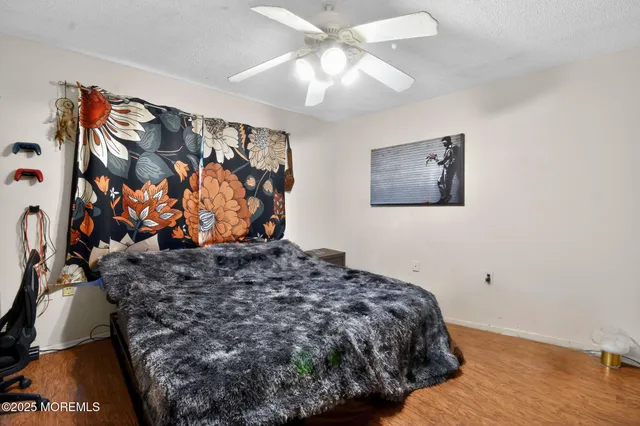 a bed room with a bed and a television