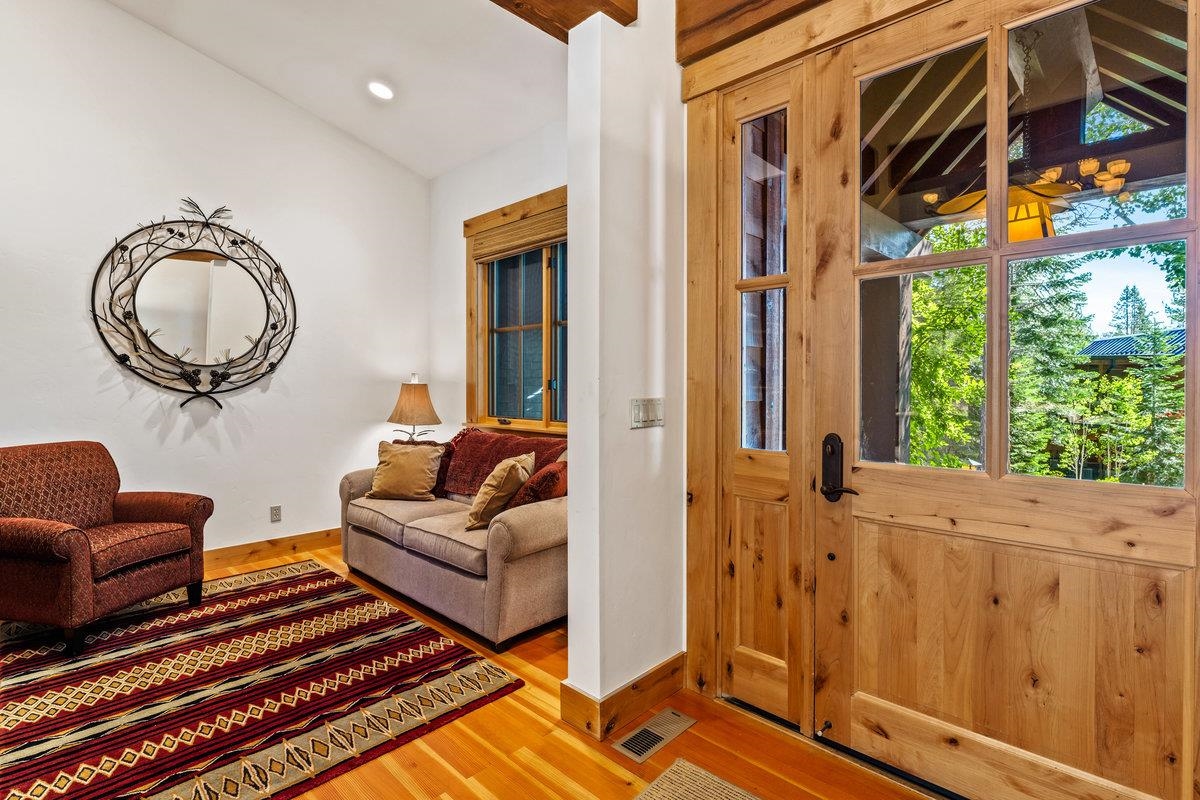 604 Ej Brickell Truckee, CA 96161 - Photo 12 of 21 a living room with furniture a floor to ceiling window and outer view