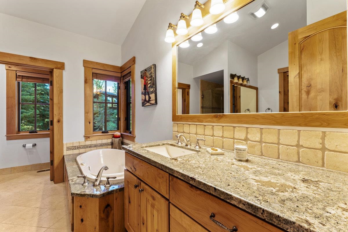 604 Ej Brickell Truckee, CA 96161 - Photo 14 of 21 a bathroom with a granite countertop sink and a mirror