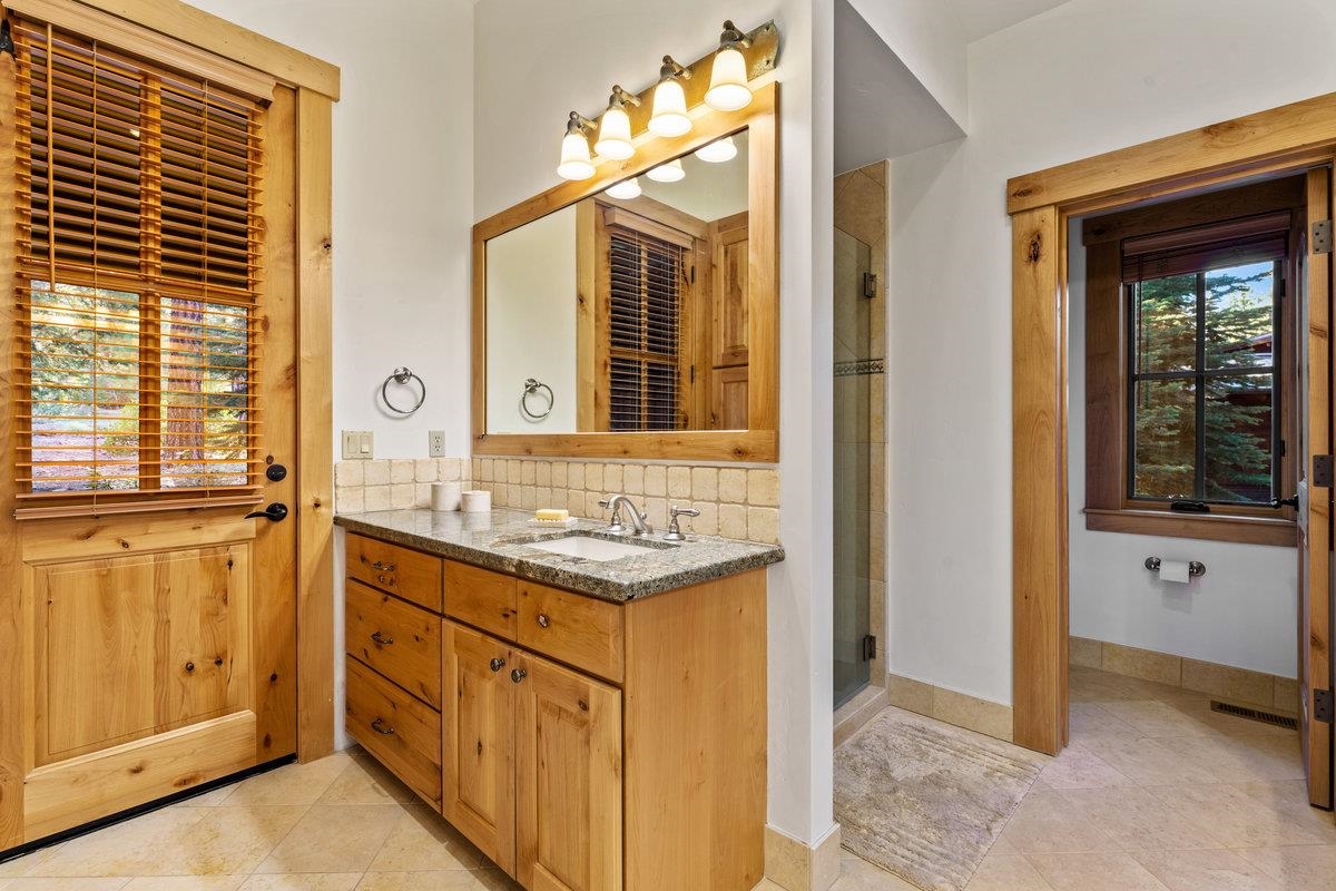 604 Ej Brickell Truckee, CA 96161 - Photo 15 of 21 a bathroom with a granite countertop sink and a mirror