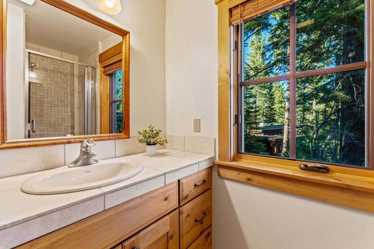 604 Ej Brickell Truckee, CA 96161 - Photo 17 of 21 a bathroom with a sink and a large mirror
