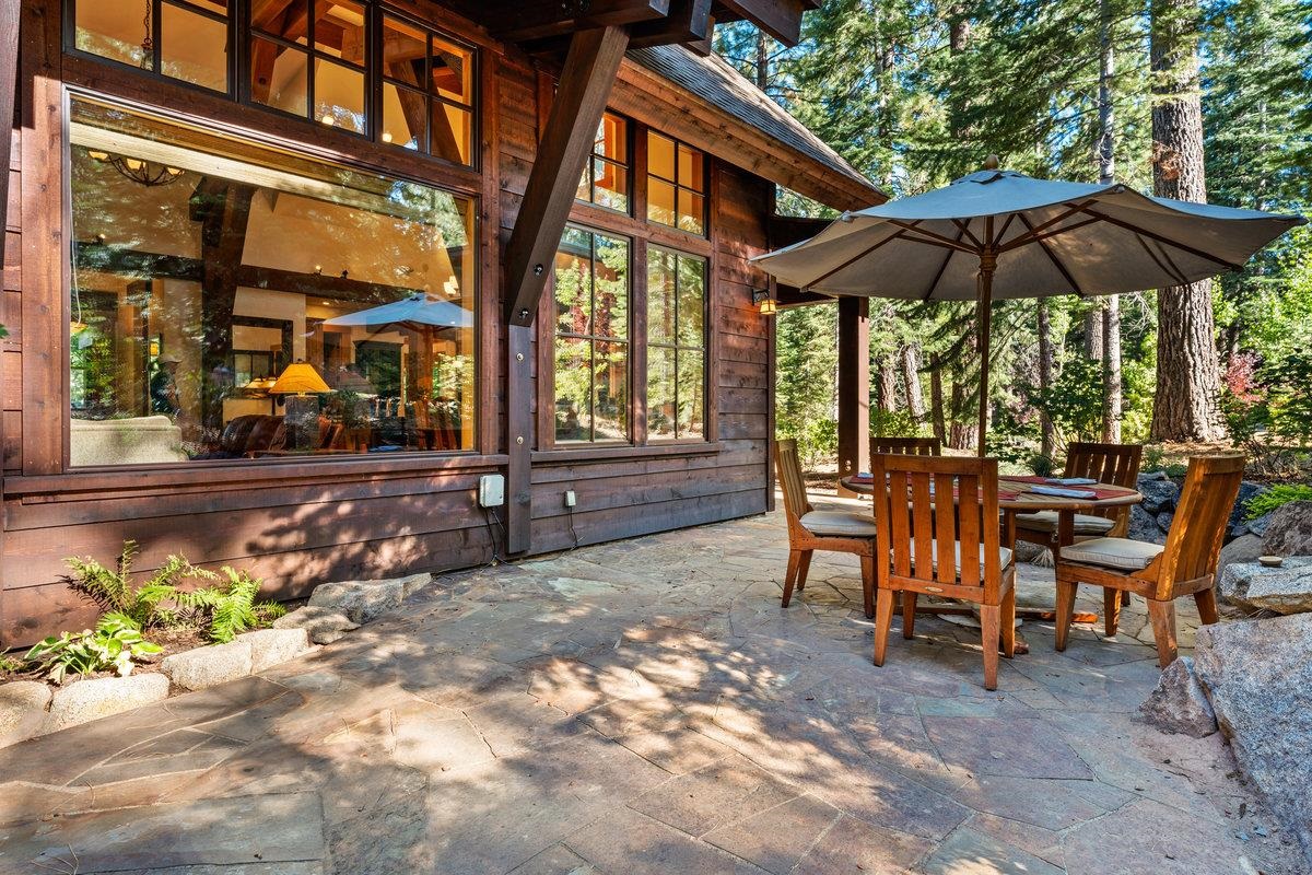 604 Ej Brickell Truckee, CA 96161 - Photo 21 of 21 a view of a patio with a table and chairs under an umbrella
