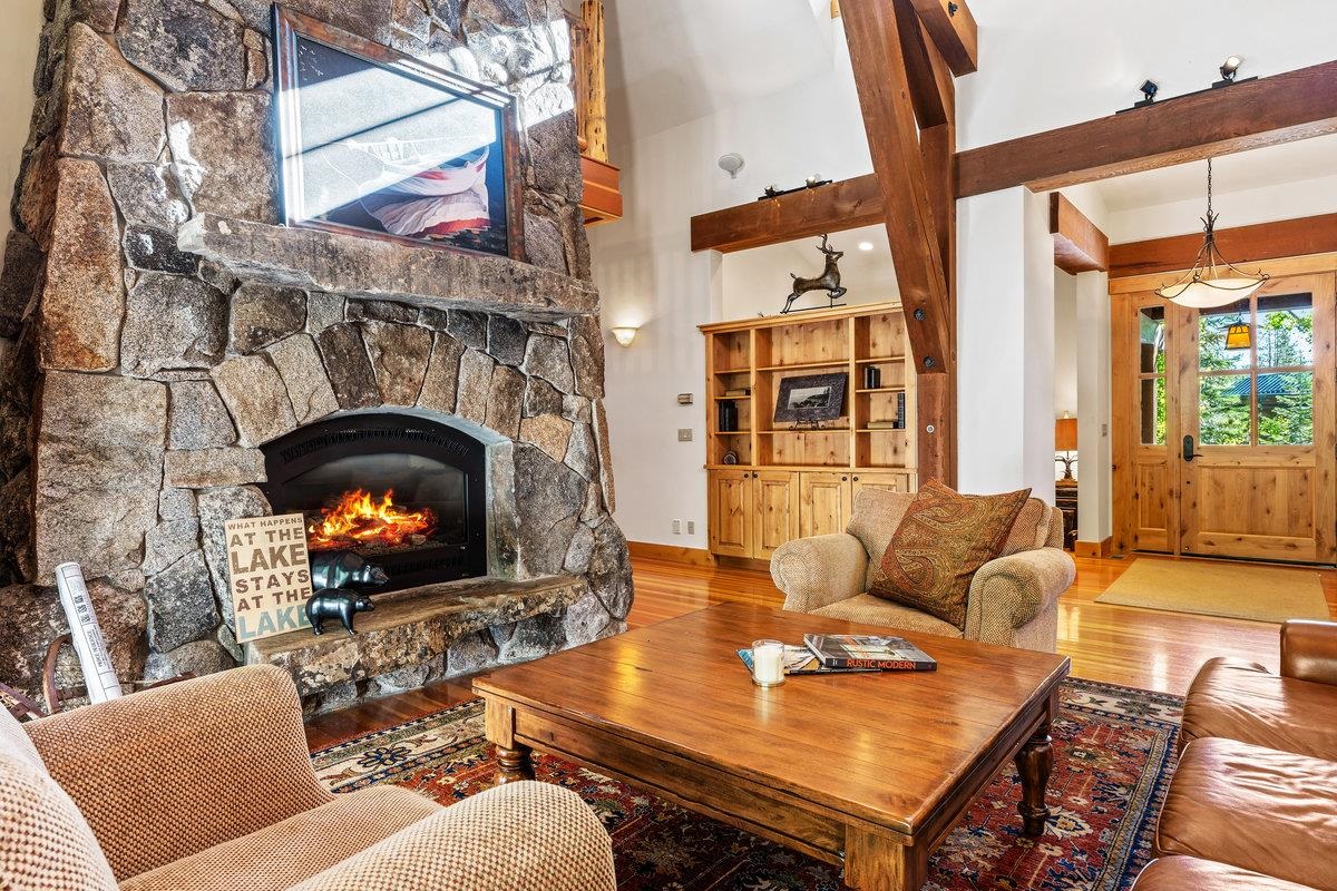 604 Ej Brickell Truckee, CA 96161 - Photo 5 of 21 a living room with furniture a fireplace and a large window