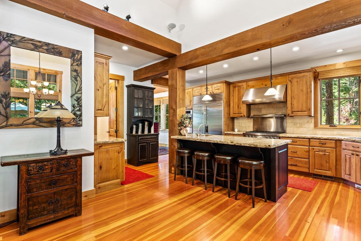 604 Ej Brickell Truckee, CA 96161 - Photo 7 of 21 a kitchen with stainless steel appliances granite countertop a stove and cabinets