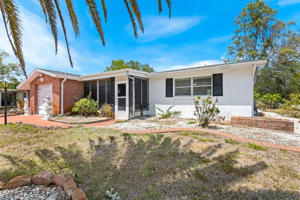 7835 Treasure Pointe Drive Port Richey, FL 34668 - Photo 1 of 1 Front