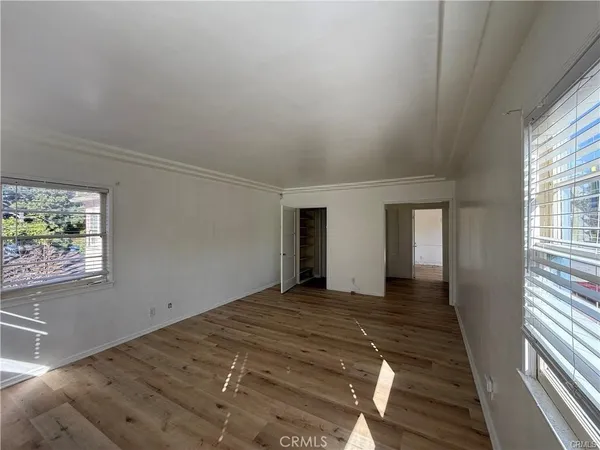 a view of hallway with wooden floor
