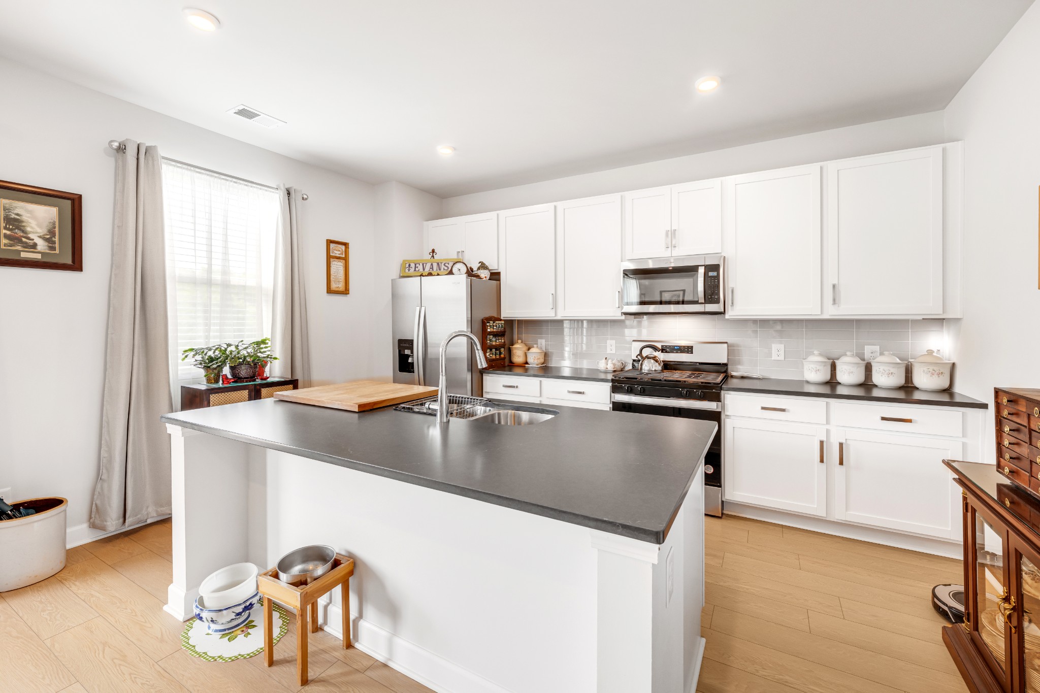 127 Millbrook Dr Spring Hill Spring Hill, TN 37174 - Photo 15 of 33 a kitchen with granite countertop a stove a sink a microwave and a refrigerator