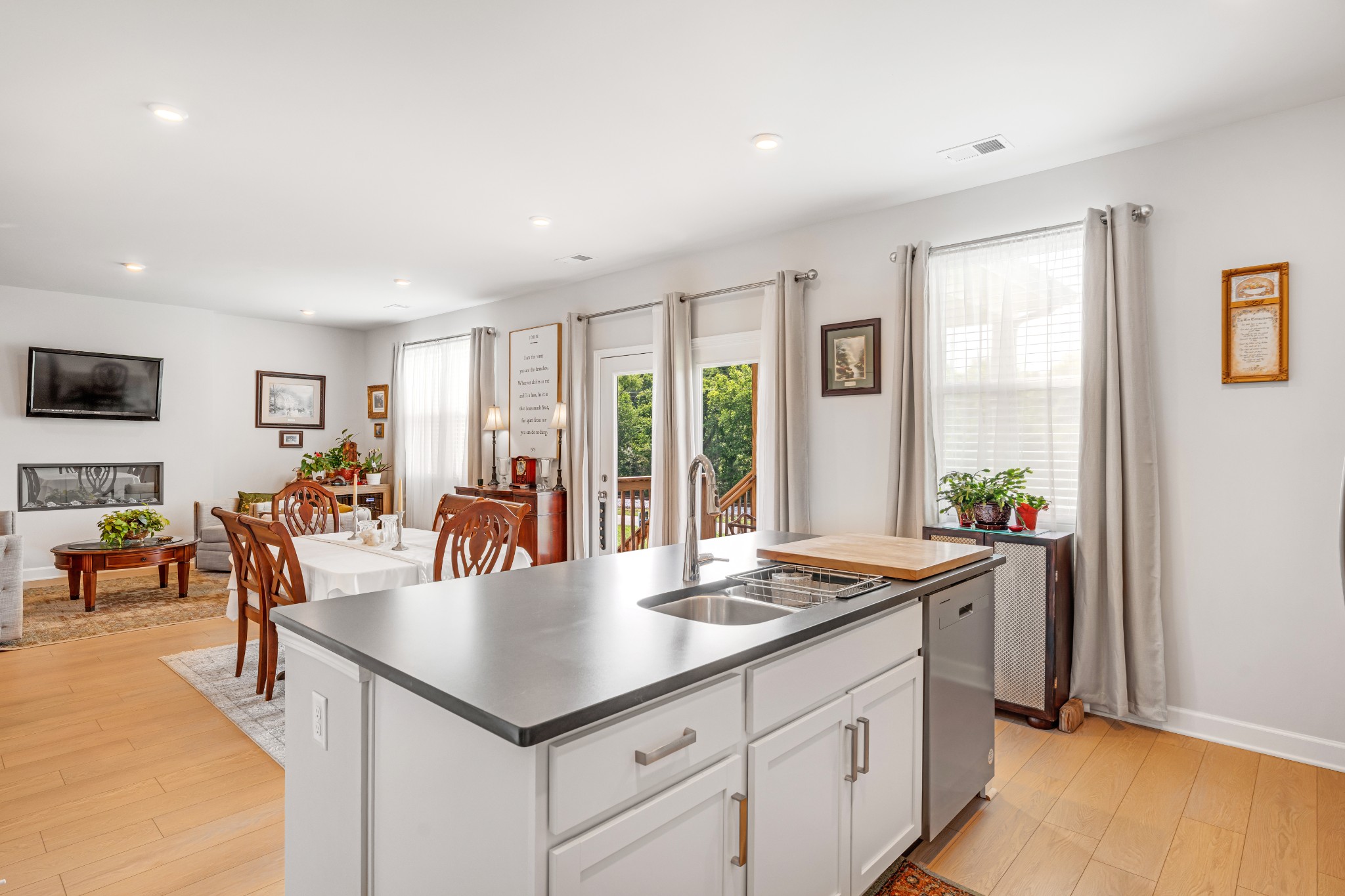 127 Millbrook Dr Spring Hill Spring Hill, TN 37174 - Photo 16 of 33 a living room with furniture a flat screen tv and a floor to ceiling window