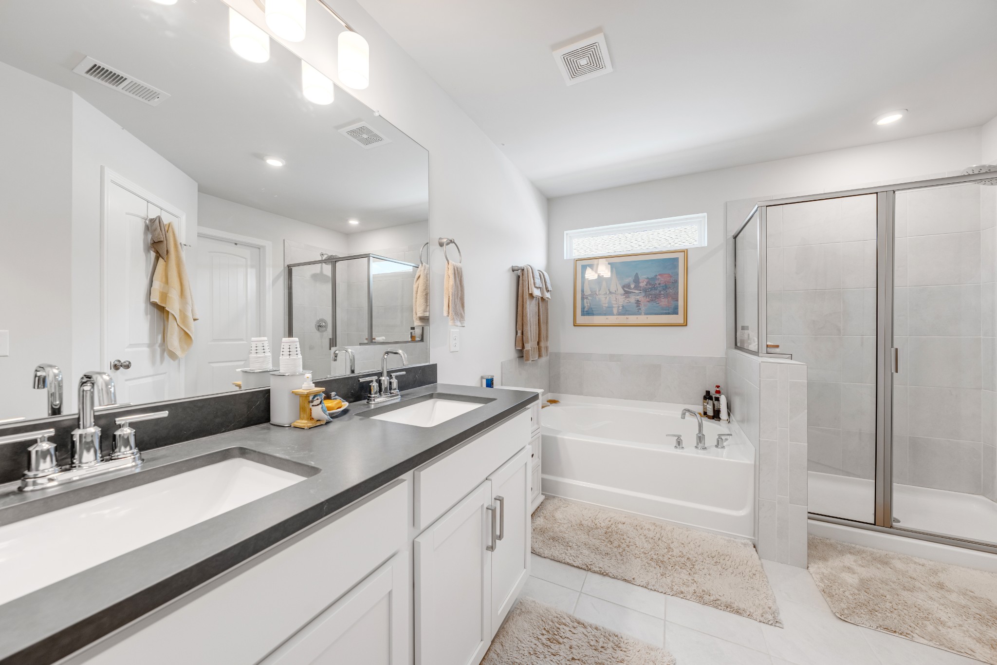 127 Millbrook Dr Spring Hill Spring Hill, TN 37174 - Photo 20 of 33 a spacious bathroom with a double vanity sink a mirror and a bathtub