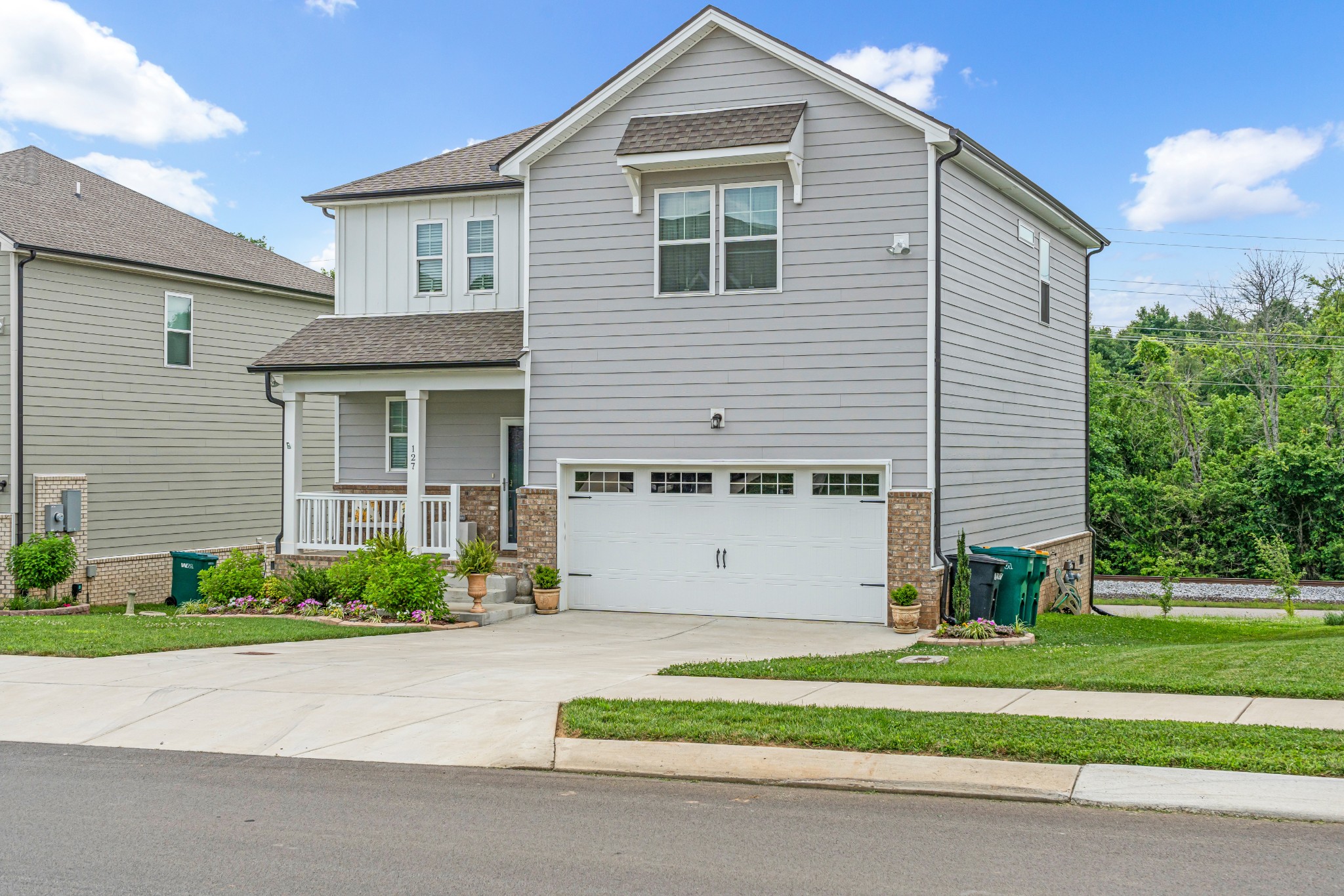 127 Millbrook Dr Spring Hill Spring Hill, TN 37174 - Photo 2 of 33 a front view of a house with a garden