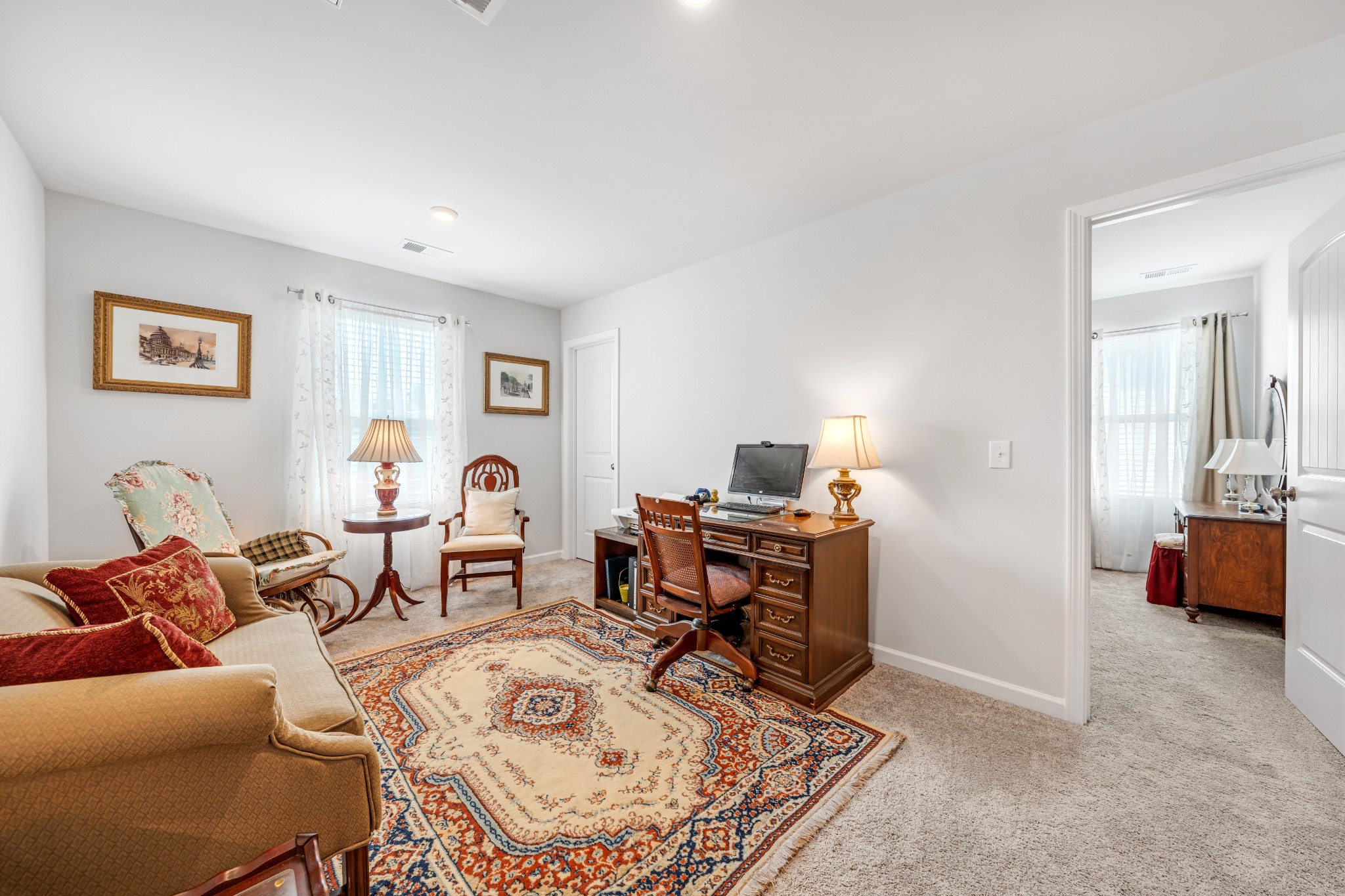127 Millbrook Dr Spring Hill Spring Hill, TN 37174 - Photo 23 of 33 a living room with furniture a rug and a table