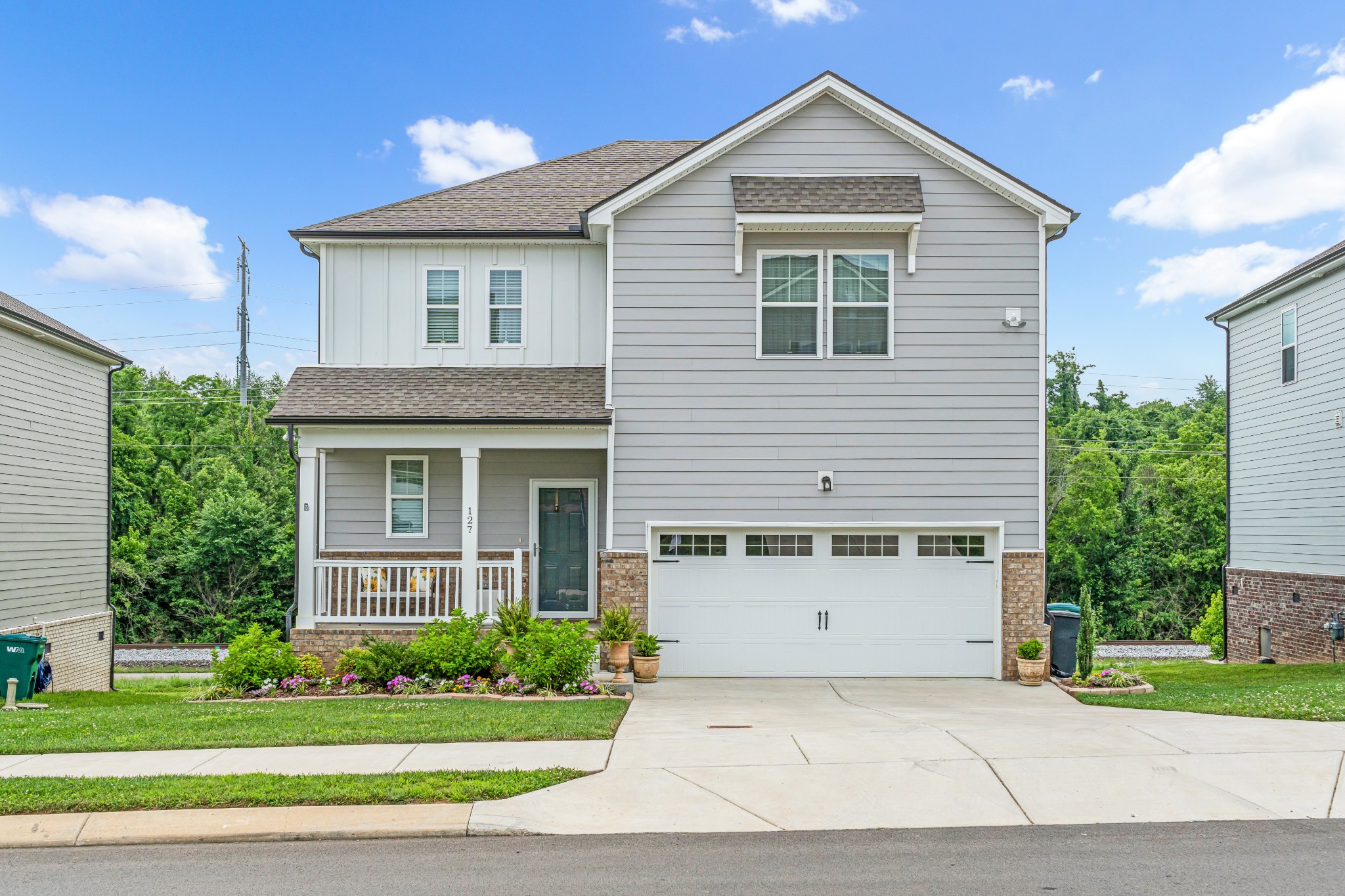 127 Millbrook Dr Spring Hill Spring Hill, TN 37174 - Photo 3 of 33 a view of a house with a yard and potted plants