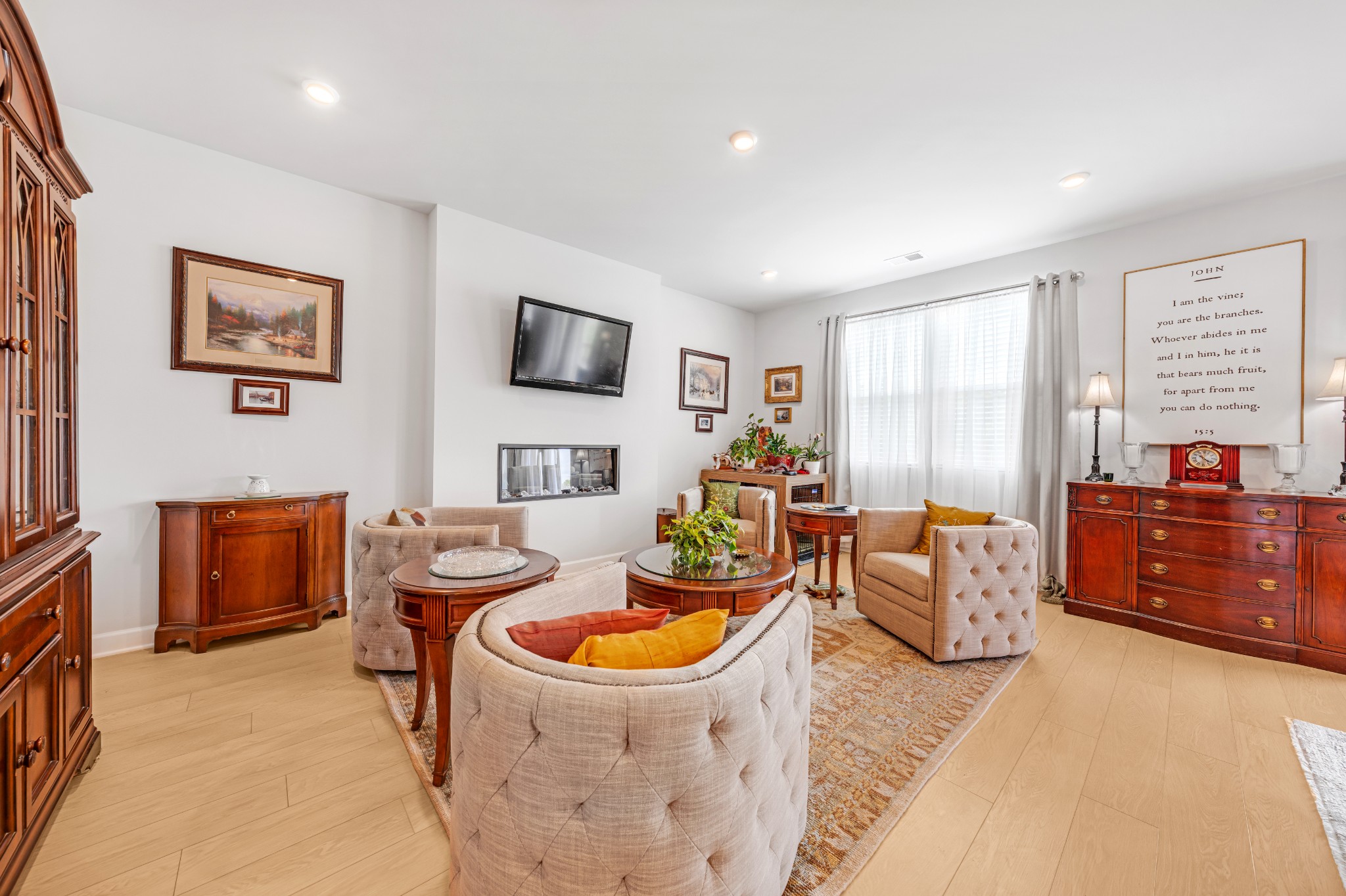127 Millbrook Dr Spring Hill Spring Hill, TN 37174 - Photo 9 of 33 a living room with furniture a flat screen tv and a refrigerator
