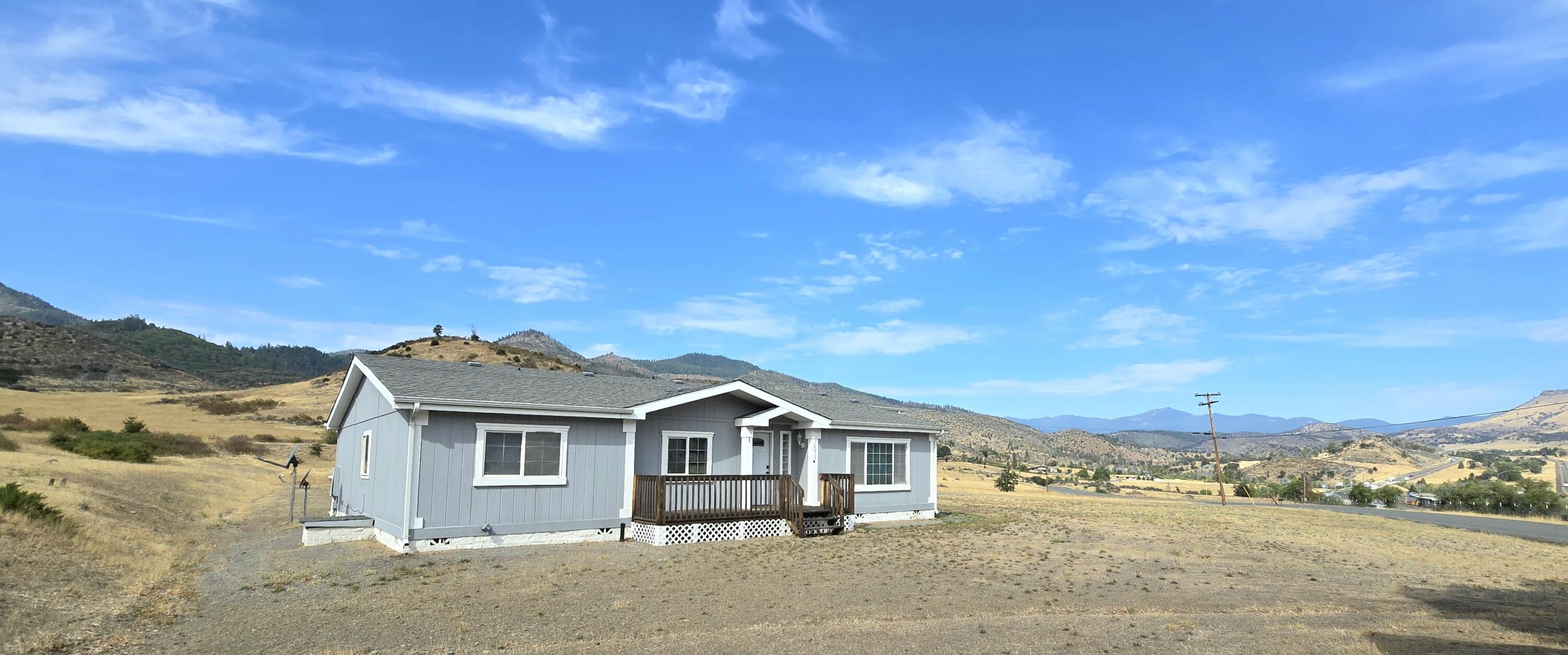 16617 Cottonwood Creek Road Hornbrook, CA 96044 - Photo 1 of 43 a front view of a house with a yard
