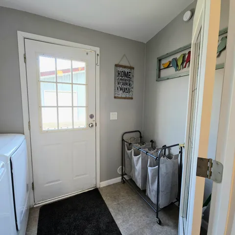 a living room with a couch and a window