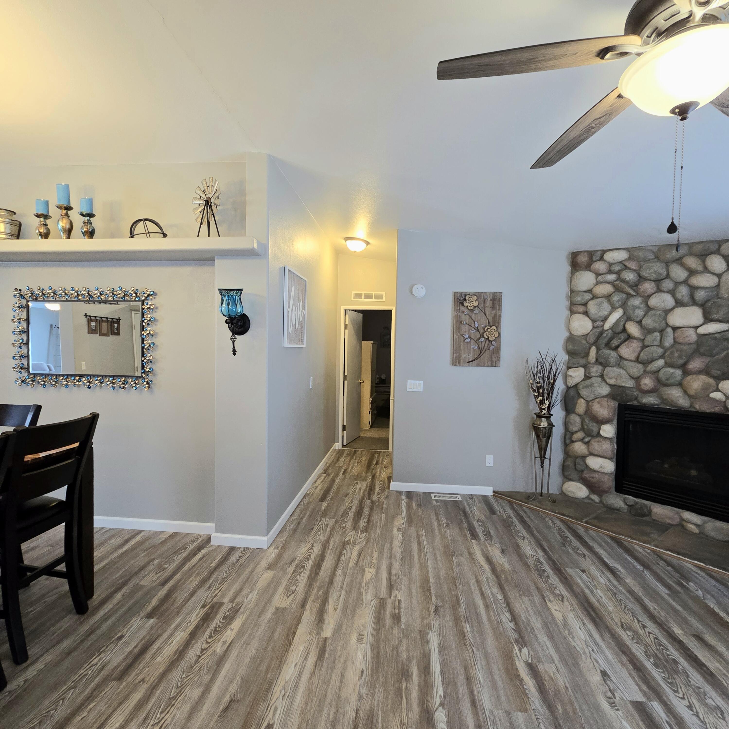 16617 Cottonwood Creek Road Hornbrook, CA 96044 - Photo 16 of 43 a view of a livingroom with wooden floor and a fireplace