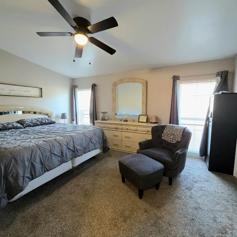 a bedroom with bed and window