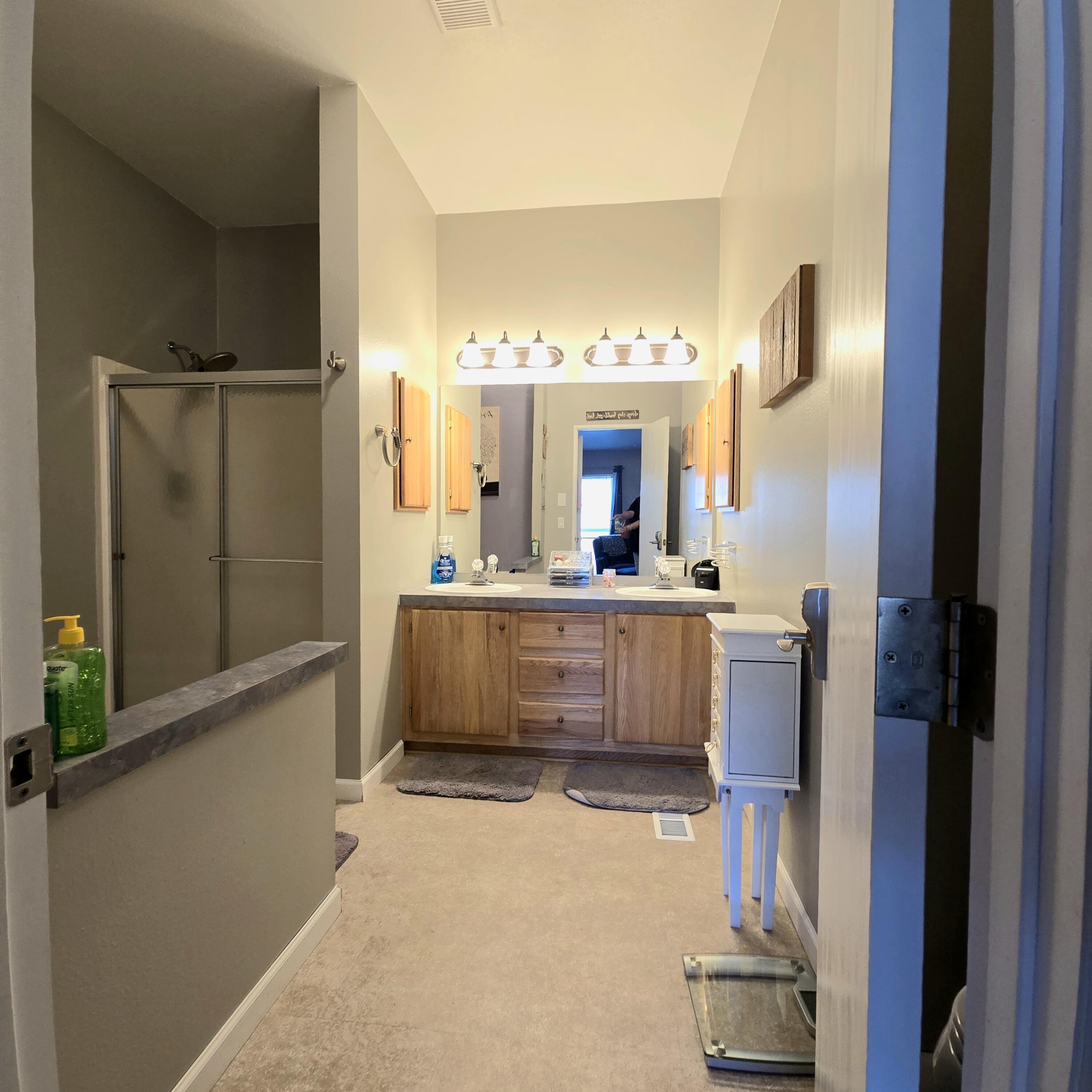 16617 Cottonwood Creek Road Hornbrook, CA 96044 - Photo 22 of 43 a bathroom with a double vanity sink mirror and shower