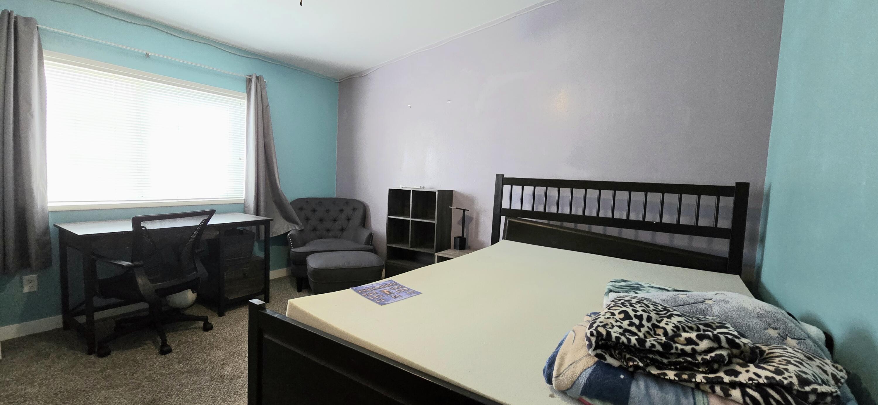 16617 Cottonwood Creek Road Hornbrook, CA 96044 - Photo 30 of 43 a bedroom with a bed and a table in it