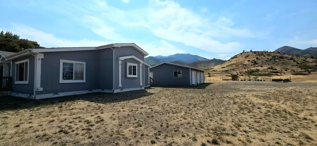 a house view with a garden space