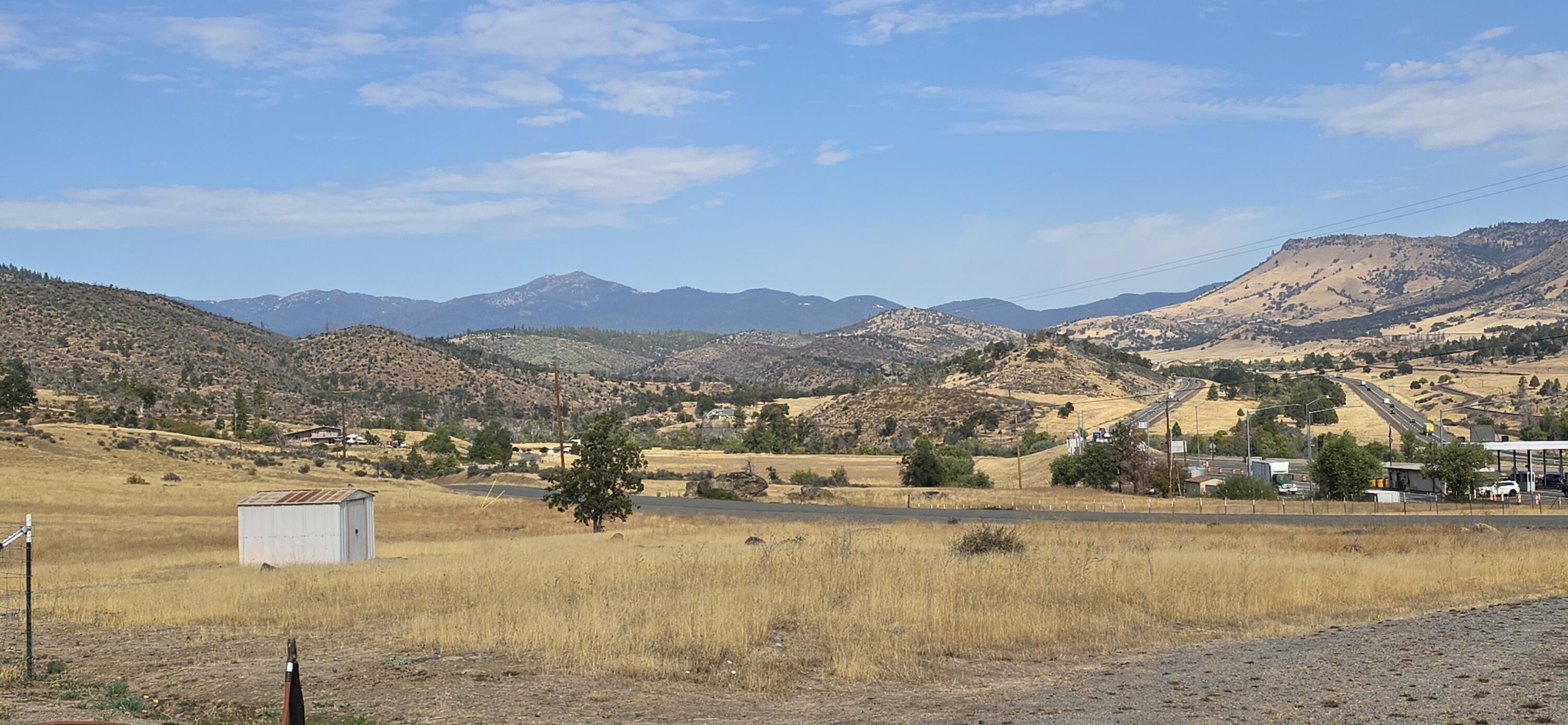 16617 Cottonwood Creek Road Hornbrook, CA 96044 - Photo 39 of 43 a view of a lake with mountains in the background