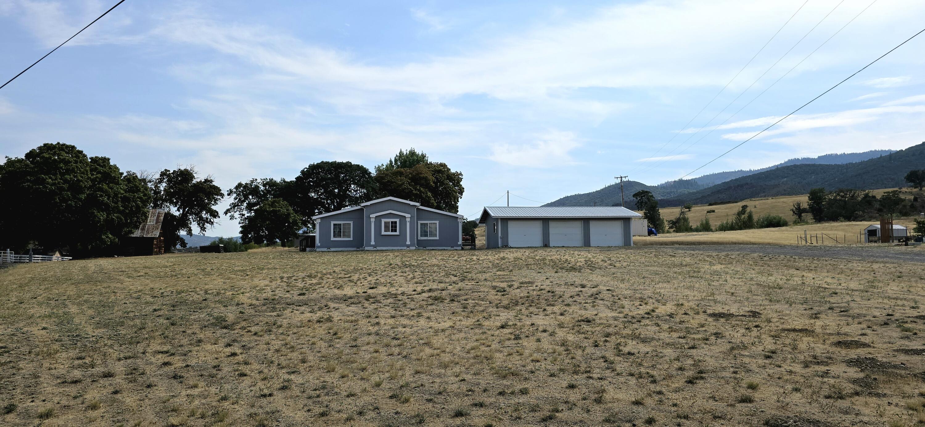 16617 Cottonwood Creek Road Hornbrook, CA 96044 - Photo 40 of 43 a view of a house with a yard