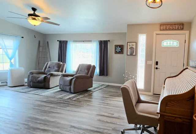 a living room with furniture and a window