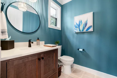 a en suite bathroom with a sink and a mirror