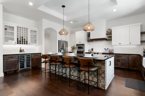 a bathroom with a double vanity sink mirror and shower