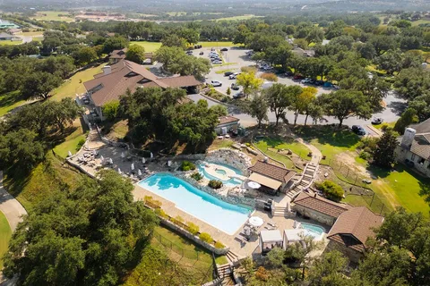 an aerial view of a house with a swimming pool